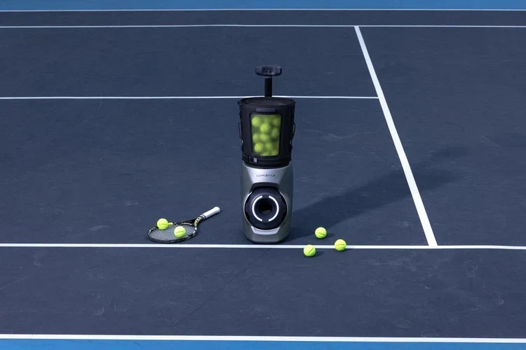 Lumistar TERO Pro AI tennis ball machine with its dual-lens vision system on a tennis court.