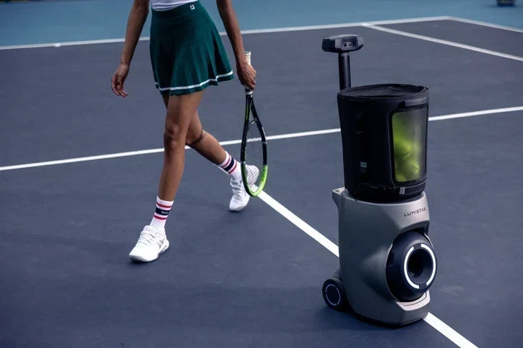 Tennis player walking beside a Lumistar TERO Pro on an outdoor court